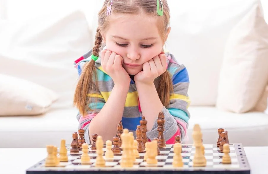 Children learning chess strategy at a top chess academy