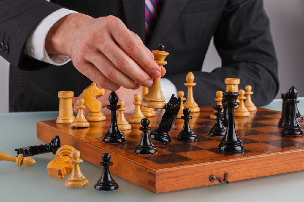 close-up-businessman-playing-chess
